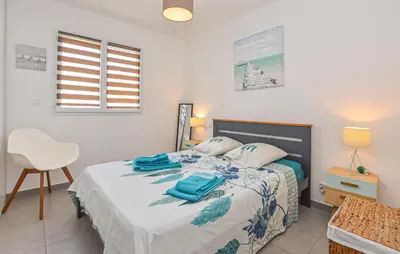 Un ou plusieurs lits dans un hébergement de l'établissement Villa Moderne Plage À Pieds