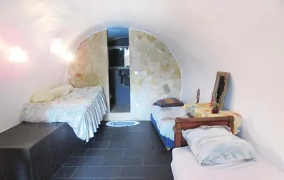 Un ou plusieurs lits dans un hébergement de l'établissement Amazing Apartment In Partinello