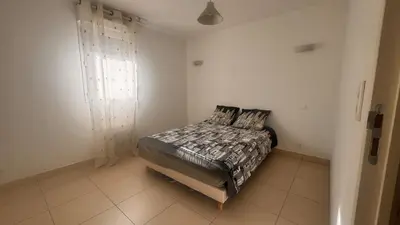 Un ou plusieurs lits dans un hébergement de l'établissement Appart 2 Chambres Charley super emplacement et parking