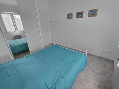 Un ou plusieurs lits dans un hébergement de l'établissement Appartement 4 pièces dans une petite résidence calme, climatisation et piscine