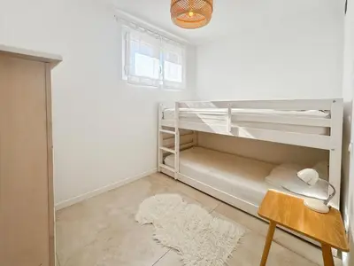 Un ou plusieurs lits dans un hébergement de l'établissement Résidence Liberta, appartement T3 en centre-ville de Calvi