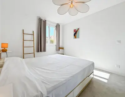 Un ou plusieurs lits dans un hébergement de l'établissement Résidence Liberta, appartement T3 en centre-ville de Calvi