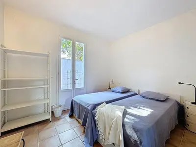 Un ou plusieurs lits dans un hébergement de l'établissement Grande maison avec vue mer et jacuzzi au cœur de Calvi