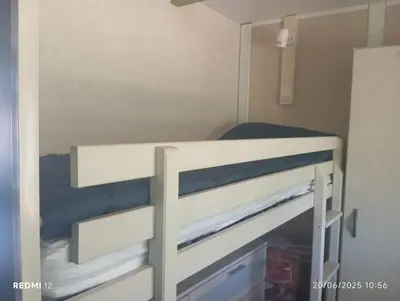 Un ou plusieurs lits dans un hébergement de l'établissement Bungalow charmant à Sorbo-Ocagnano avec jardin