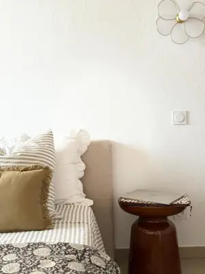 Un ou plusieurs lits dans un hébergement de l'établissement Appartement 2 CHAMBRES PISCINE TERRASSE SAINT FLORENT