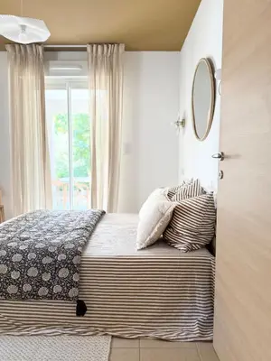 Un ou plusieurs lits dans un hébergement de l'établissement Appartement 2 CHAMBRES PISCINE TERRASSE SAINT FLORENT