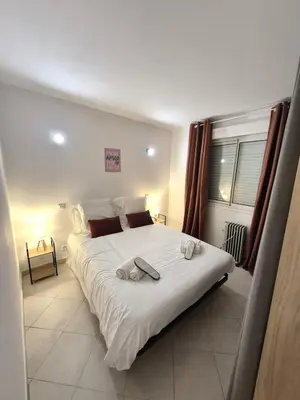 Un ou plusieurs lits dans un hébergement de l'établissement rez de villa confort & grand extérieur