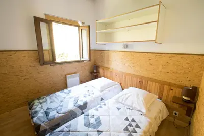 Un ou plusieurs lits dans un hébergement de l'établissement Sarl Aurore-Vacances