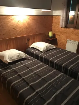 Un ou plusieurs lits dans un hébergement de l'établissement Sarl Aurore-Vacances