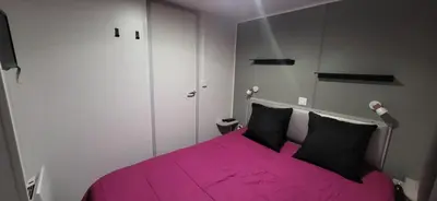 Un ou plusieurs lits dans un hébergement de l'établissement Bungalow le Sartène