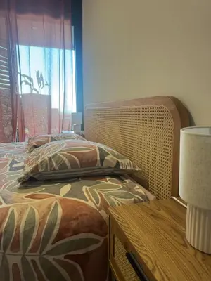 Un ou plusieurs lits dans un hébergement de l'établissement Appartement vue mer et montagne