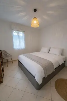 Un ou plusieurs lits dans un hébergement de l'établissement Bel appartement 4 personnes