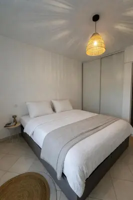 Un ou plusieurs lits dans un hébergement de l'établissement Bel appartement 4 personnes