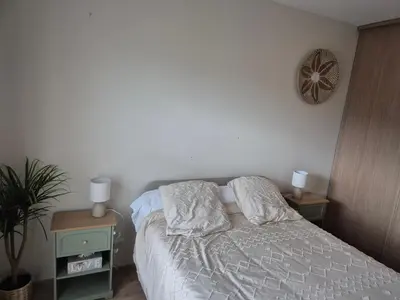 Un ou plusieurs lits dans un hébergement de l'établissement Mer et Montagne Appartement Prestigieux 7 couchages et salle de sport