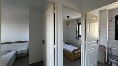 Un ou plusieurs lits dans un hébergement de l'établissement Location appartement 6 pers les marines de Bravone