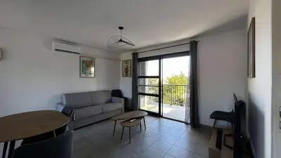 Coin salon dans l'établissement Location appartement 6 pers les marines de Bravone