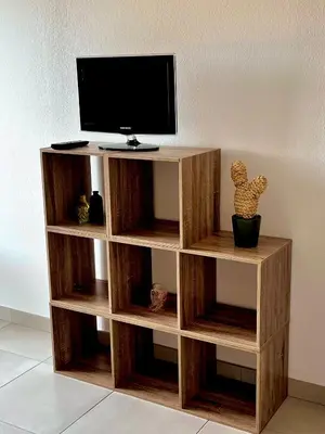 Télévision ou salle de divertissement dans l'établissement La maison des vacances