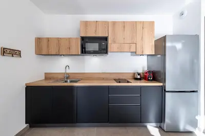 Cuisine ou kitchenette dans l'établissement Casa Fangu - Balcon avec Vue Port et Montagnes