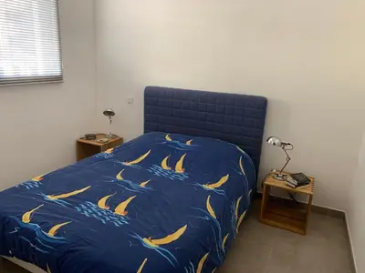 Un ou plusieurs lits dans un hébergement de l'établissement Appartement vue mer centre
