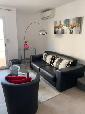 Coin salon dans l'établissement Appartement vue mer centre
