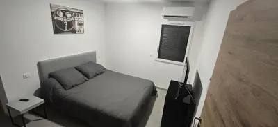 Un ou plusieurs lits dans un hébergement de l'établissement Appartement neuf 4 personnes RDC villa