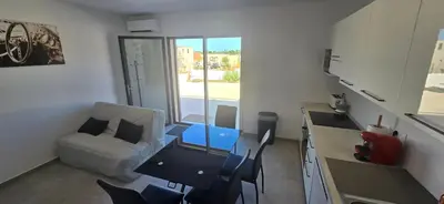 Coin salon dans l'établissement Appartement neuf 4 personnes RDC villa
