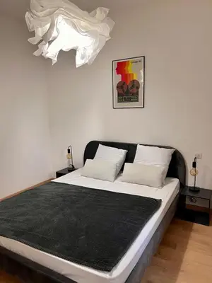 Un ou plusieurs lits dans un hébergement de l'établissement Village centre appartement