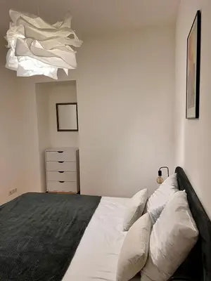 Un ou plusieurs lits dans un hébergement de l'établissement Village centre appartement
