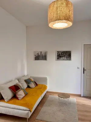 Coin salon dans l'établissement Village centre appartement