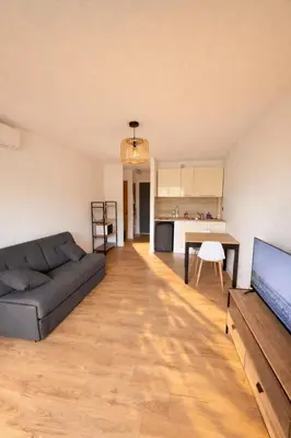 Coin salon dans l'établissement Cozy studio in Calvi Beach 2 min walk parking
