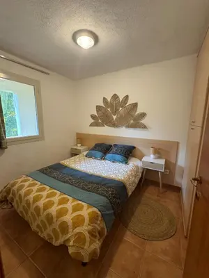 Un ou plusieurs lits dans un hébergement de l'établissement Appartement avec piscine en Bord de Mer - Corse