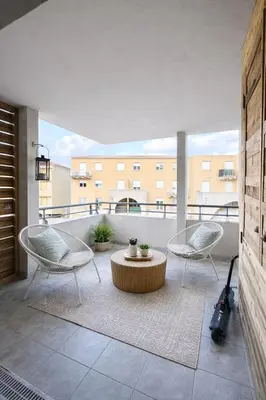 Coin salon dans l'établissement Appartement CALVI lumineux avec terrasse