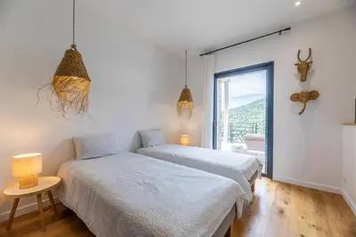 Un ou plusieurs lits dans un hébergement de l'établissement Villa de standing vue mer