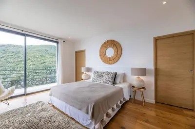 Un ou plusieurs lits dans un hébergement de l'établissement Villa de standing vue mer