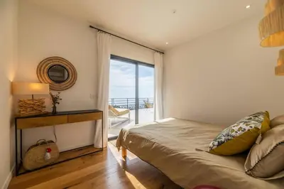 Un ou plusieurs lits dans un hébergement de l'établissement Villa de standing vue mer