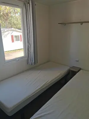 Un ou plusieurs lits dans un hébergement de l'établissement Village Camping de l'Ostriconi 3 étoiles