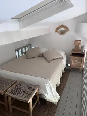Un ou plusieurs lits dans un hébergement de l'établissement Maison face à la mer