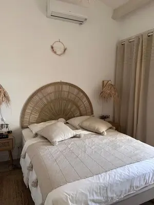 Un ou plusieurs lits dans un hébergement de l'établissement Maison face à la mer