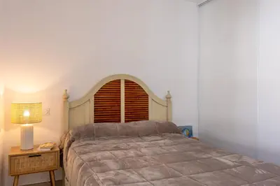 Un ou plusieurs lits dans un hébergement de l'établissement Casa Catalina Charme contemporain à lÎle-Rousse