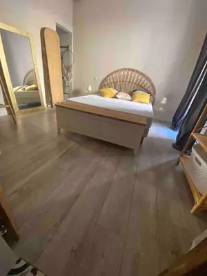 Un ou plusieurs lits dans un hébergement de l'établissement Appartement climatisé avec parking privé au cœur de la vieille ville