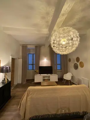 Un ou plusieurs lits dans un hébergement de l'établissement Appartement climatisé avec parking privé au cœur de la vieille ville