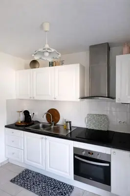 Cuisine ou kitchenette dans l'établissement Appart cosy - Lumineux avec terrasse