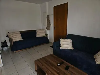 Coin salon dans l'établissement Grand T2 A DEUX PAS DE LA PLAGE LOZARI