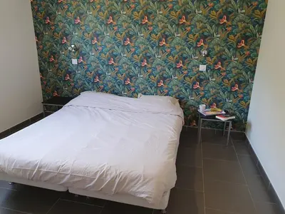 Un ou plusieurs lits dans un hébergement de l'établissement maison être mer et montagne