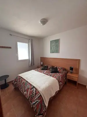 Un ou plusieurs lits dans un hébergement de l'établissement Appartement bord de mer