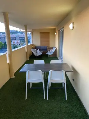 Coin salon dans l'établissement Appartement avec grande terrasse