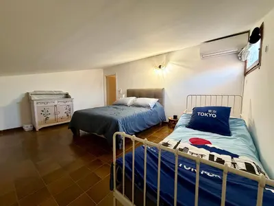Un ou plusieurs lits dans un hébergement de l'établissement Charmant Duplex proche mer, Clim Terrasse à BORGO