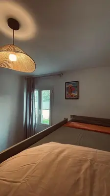 Un ou plusieurs lits dans un hébergement de l'établissement Villa Paraìso, maison avec piscine route de Calenzana