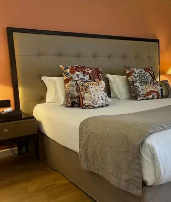 Un ou plusieurs lits dans un hébergement de l'établissement Hôtel Des Gouverneurs