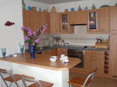 Cuisine ou kitchenette dans l'établissement Pont du Bateau